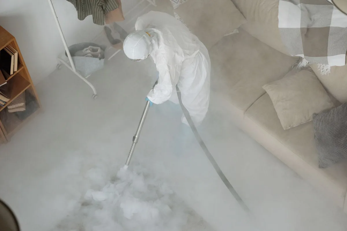 Biohazard cleanup technician in protective equipment, Evansdale, IA